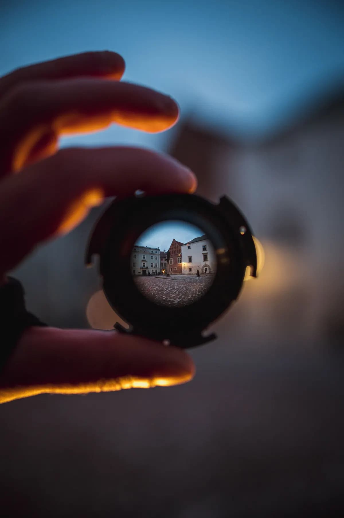 A person discovering local activities on their phone by a window