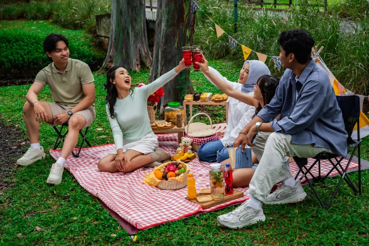 Friends gathering together around a picnic